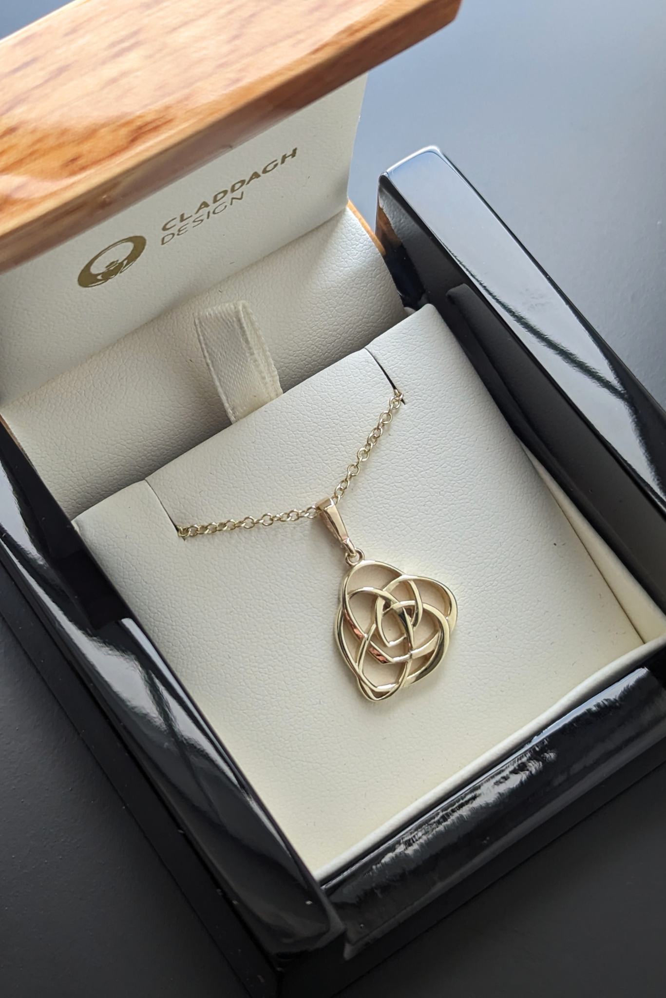 gold celtic motherhood knot pendant necklace in box