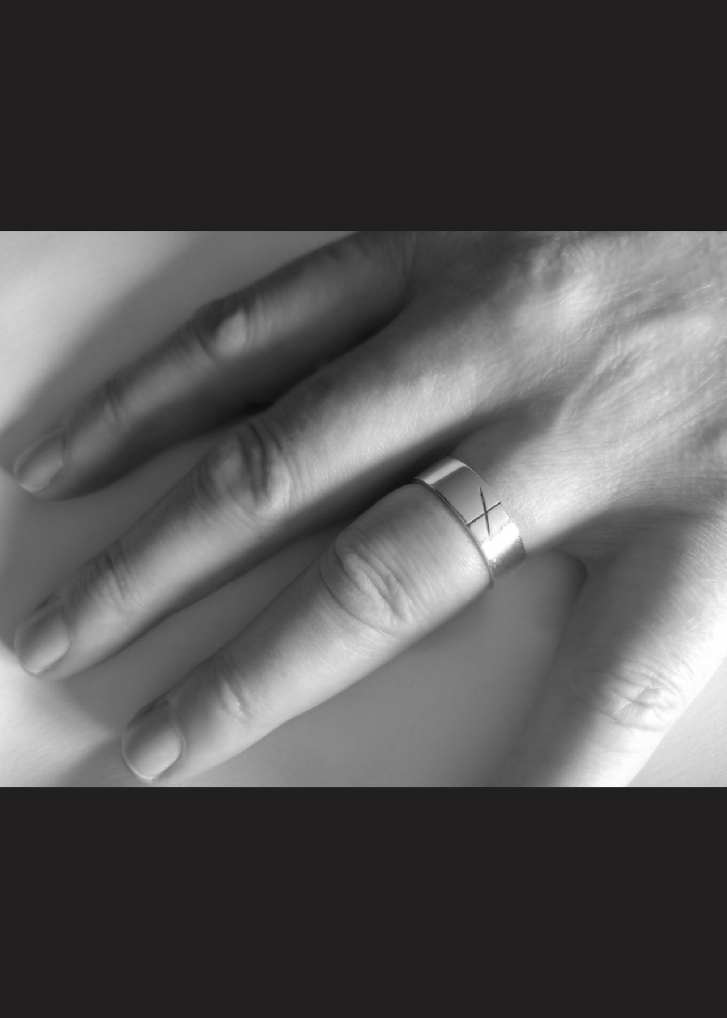 men's Ogham ring on man's hand