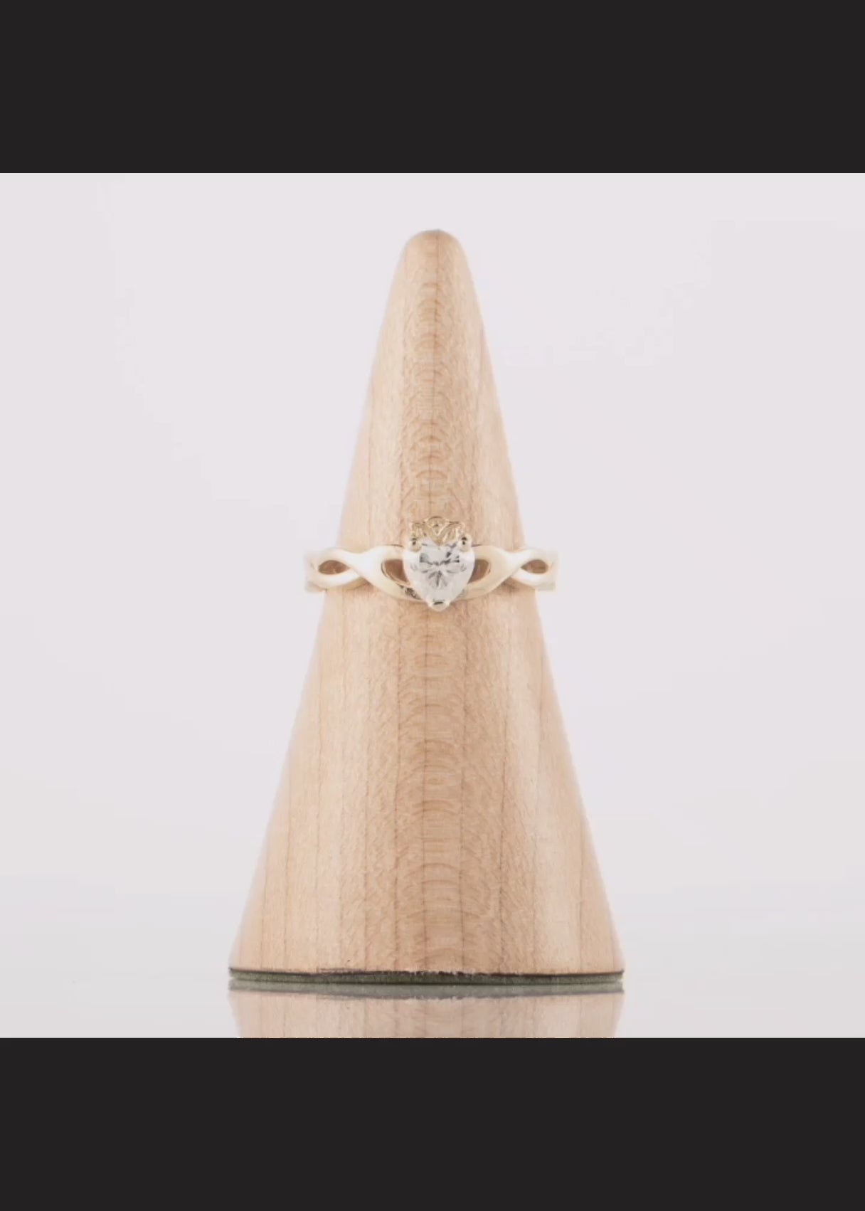 360 degree video of a diamond Claddagh Ring in gold. The video shows the double twist weave band
