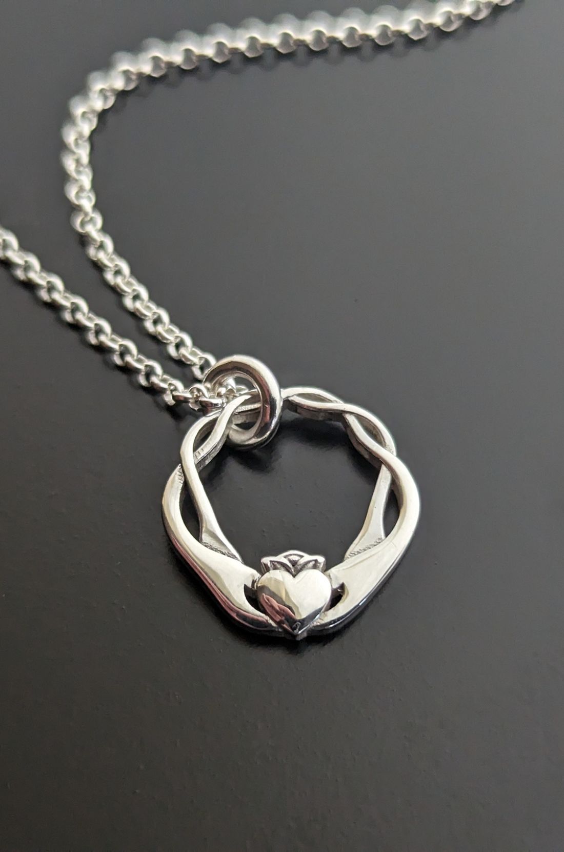 Close up image of Infinity Claddagh Pendant