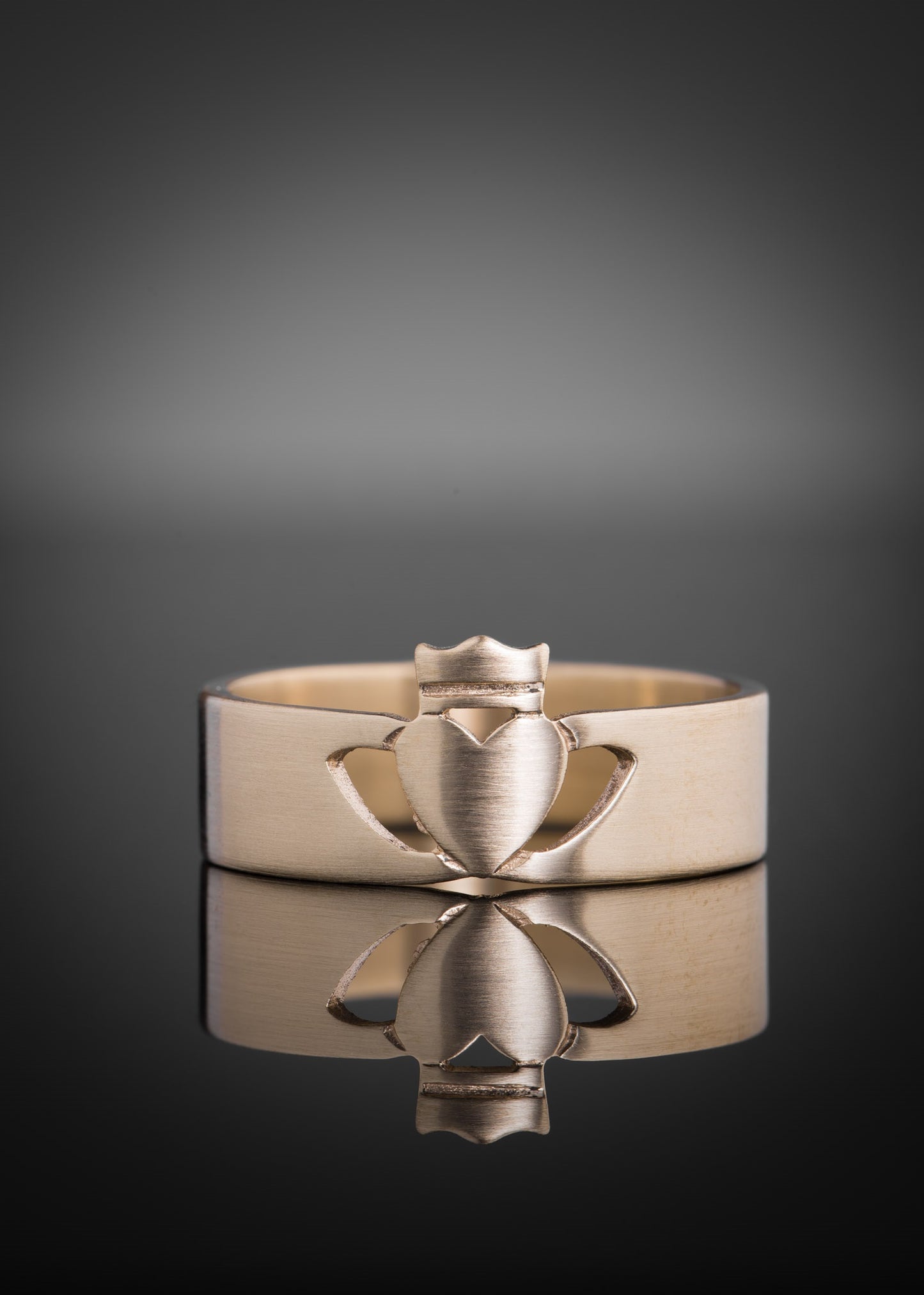 Gold Men's Claddagh Ring in a modern style