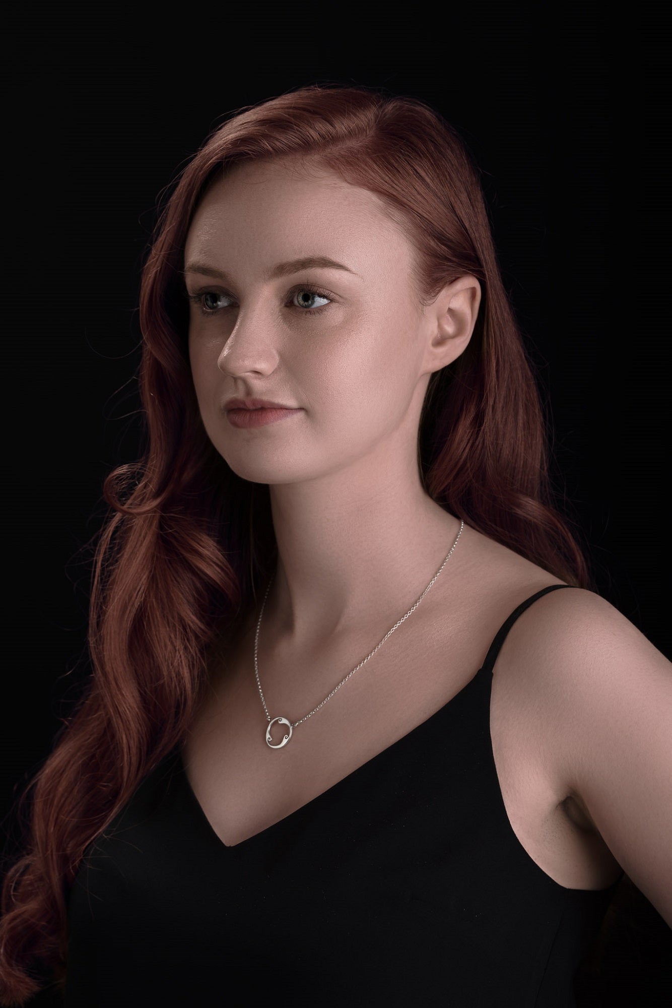 silver triskele pendant
