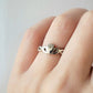 Claddagh ring twist band on models hand