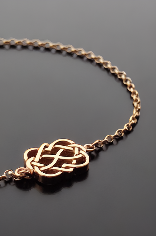 celtic love knot bracelet in gold close up