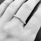 The claddagh eternity band on a model's hand