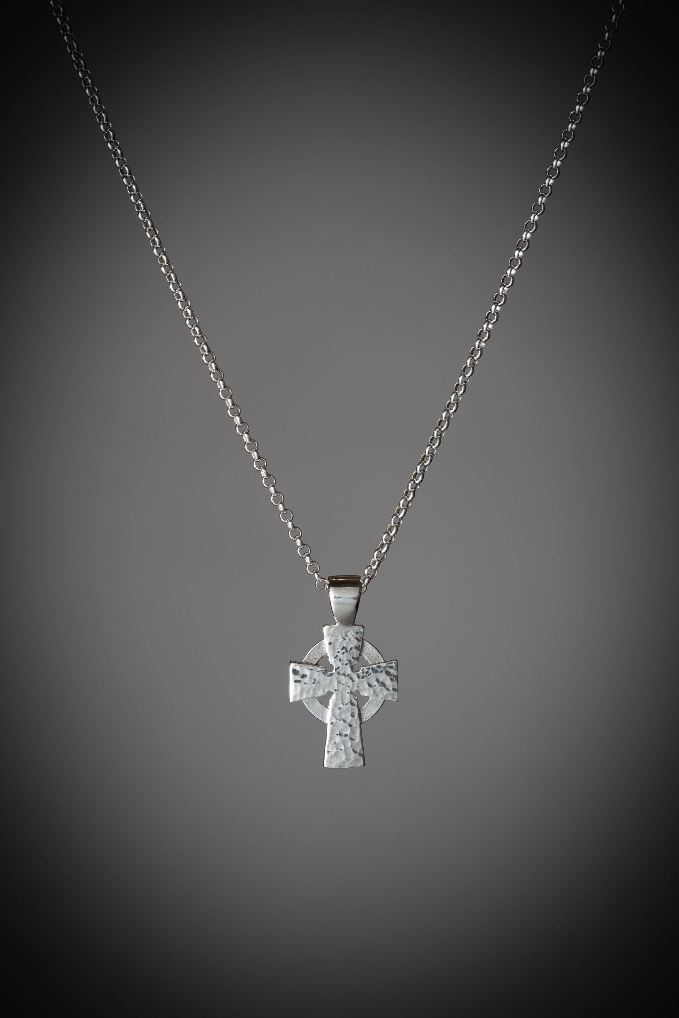 contemporary celtic cross pendant necklace in sterling silver with a weathered hammered finish
