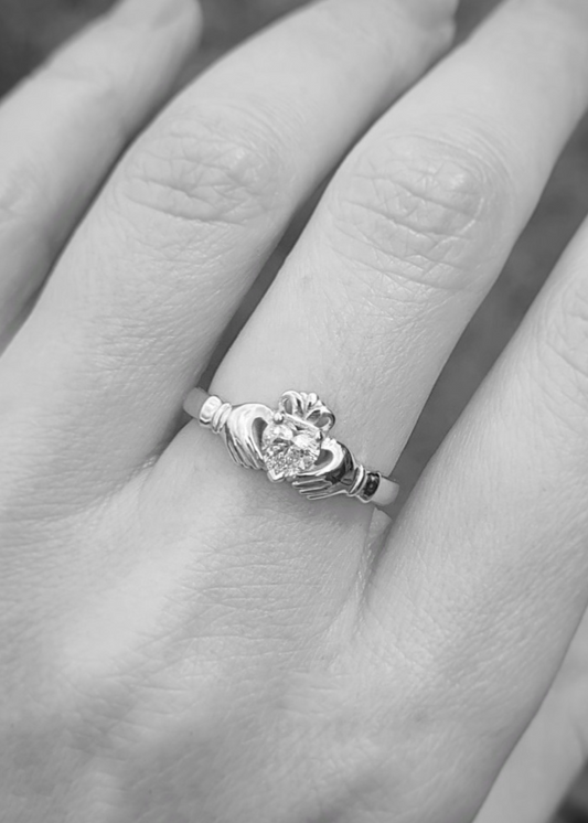 diamond claddagh ring on models hand