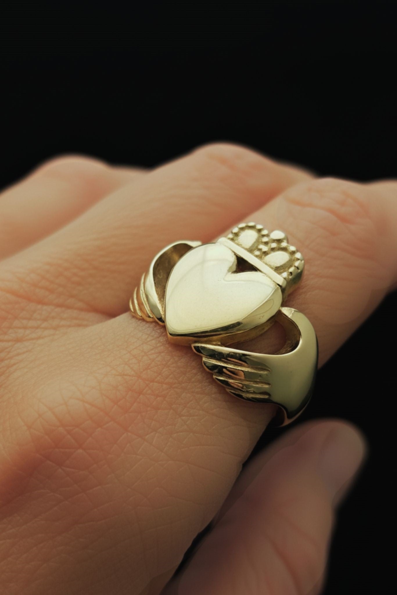 large chunky claddagh ring on model's finger