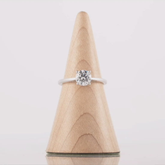 Video shows the solitaire diamond engagement ring rotating for a 360 degree view