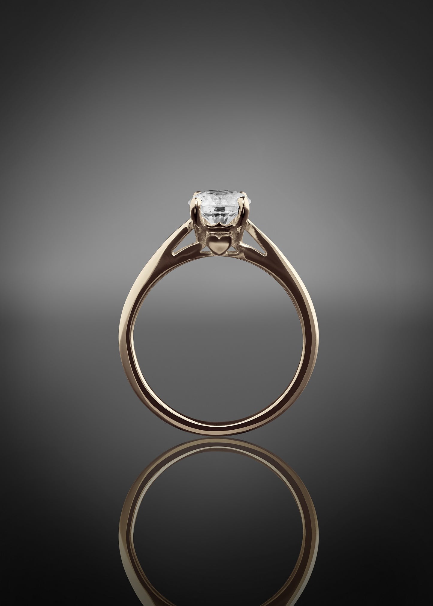 side view of the solitaire engagement ring with Claddagh setting