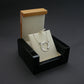 silver triskele pendant necklace in box