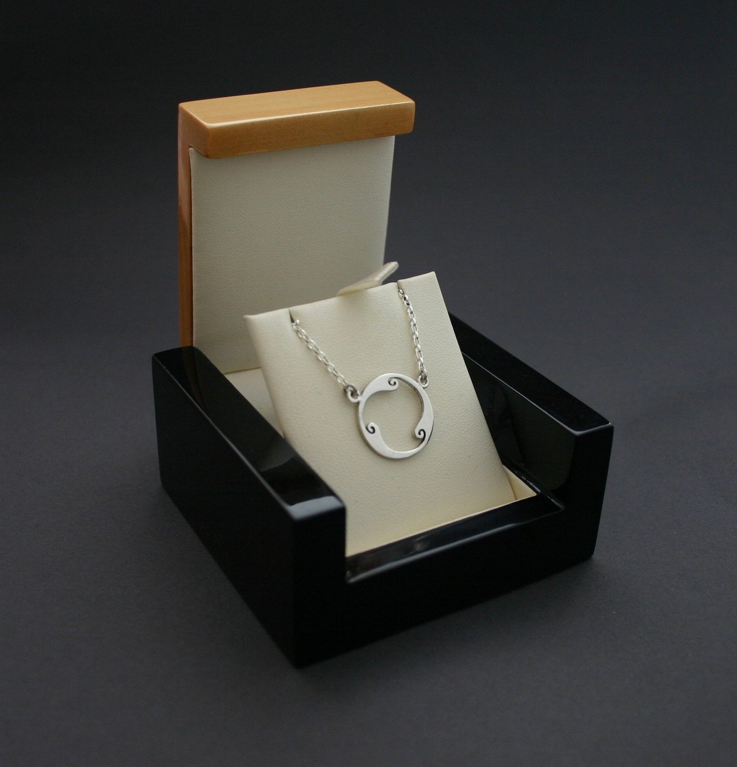 silver triskele pendant necklace in box