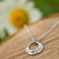 celtic torc pendant necklace on wooden display