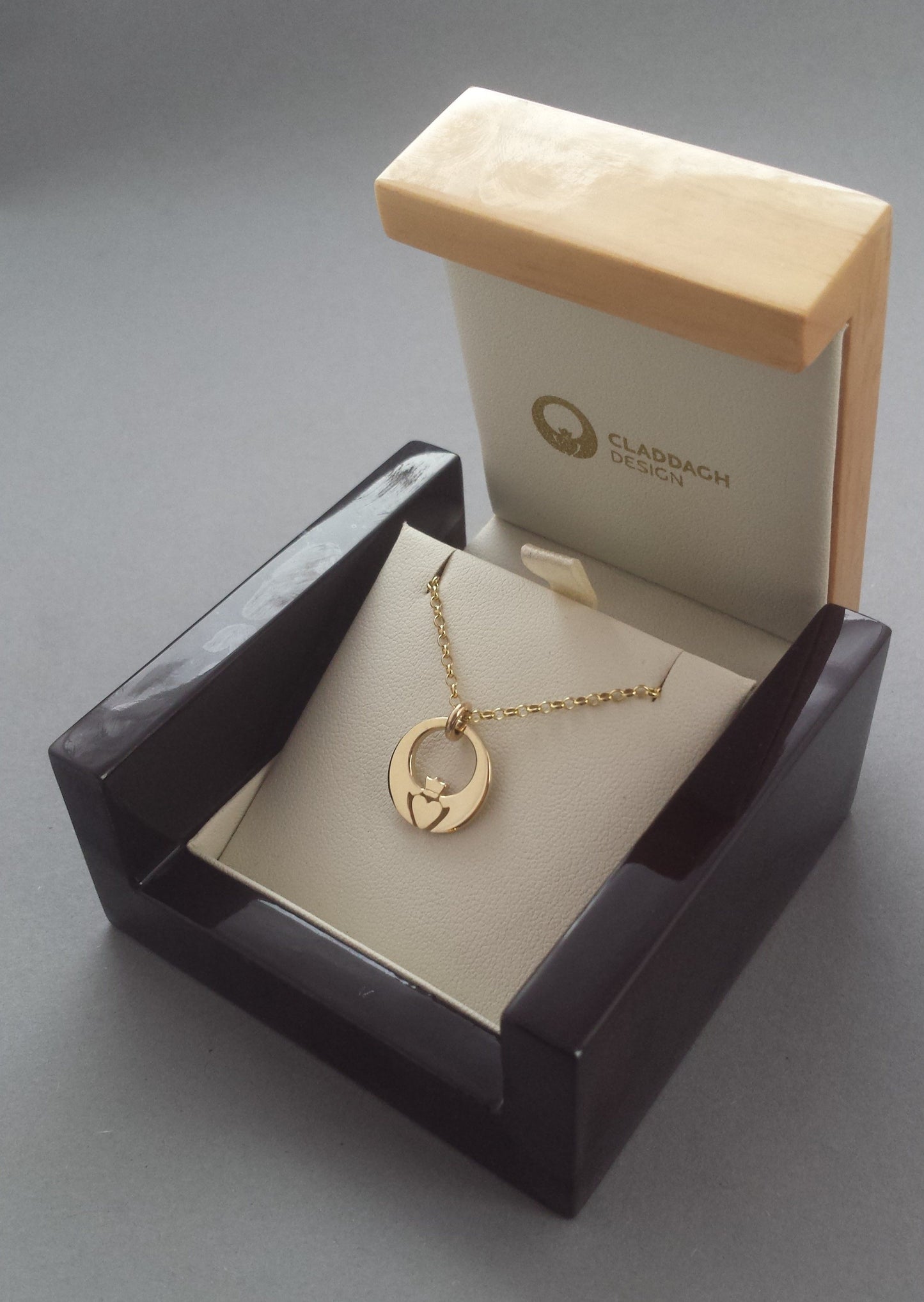 Gold Claddagh pendant in box
