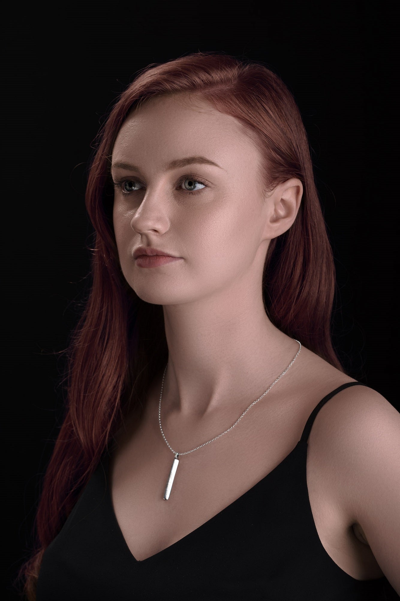 Neart Ogham pendant on model