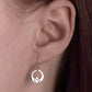 silver claddagh earrings on model