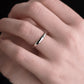 white Gold Ogham wedding ring on a models hand