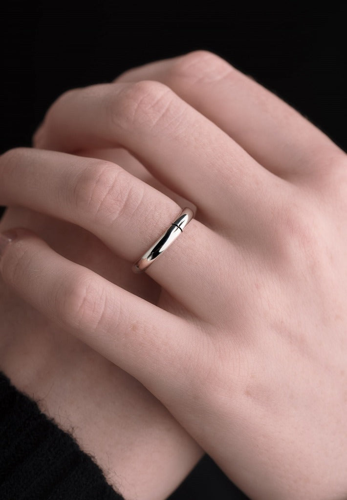 white Gold Ogham wedding ring on a models hand