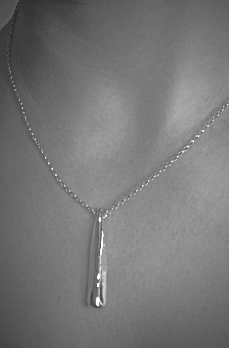 personailsed ogham family pendant on model