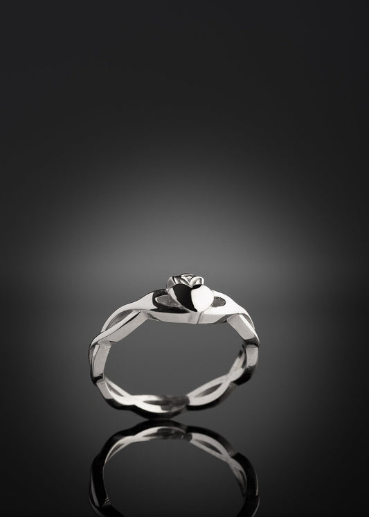 silver claddagh ring with twist band at an angle