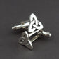 Silver Trinity Knot Cufflinks on a grey background