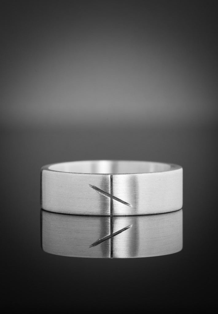 white gold ogham wedding band in a matte finish